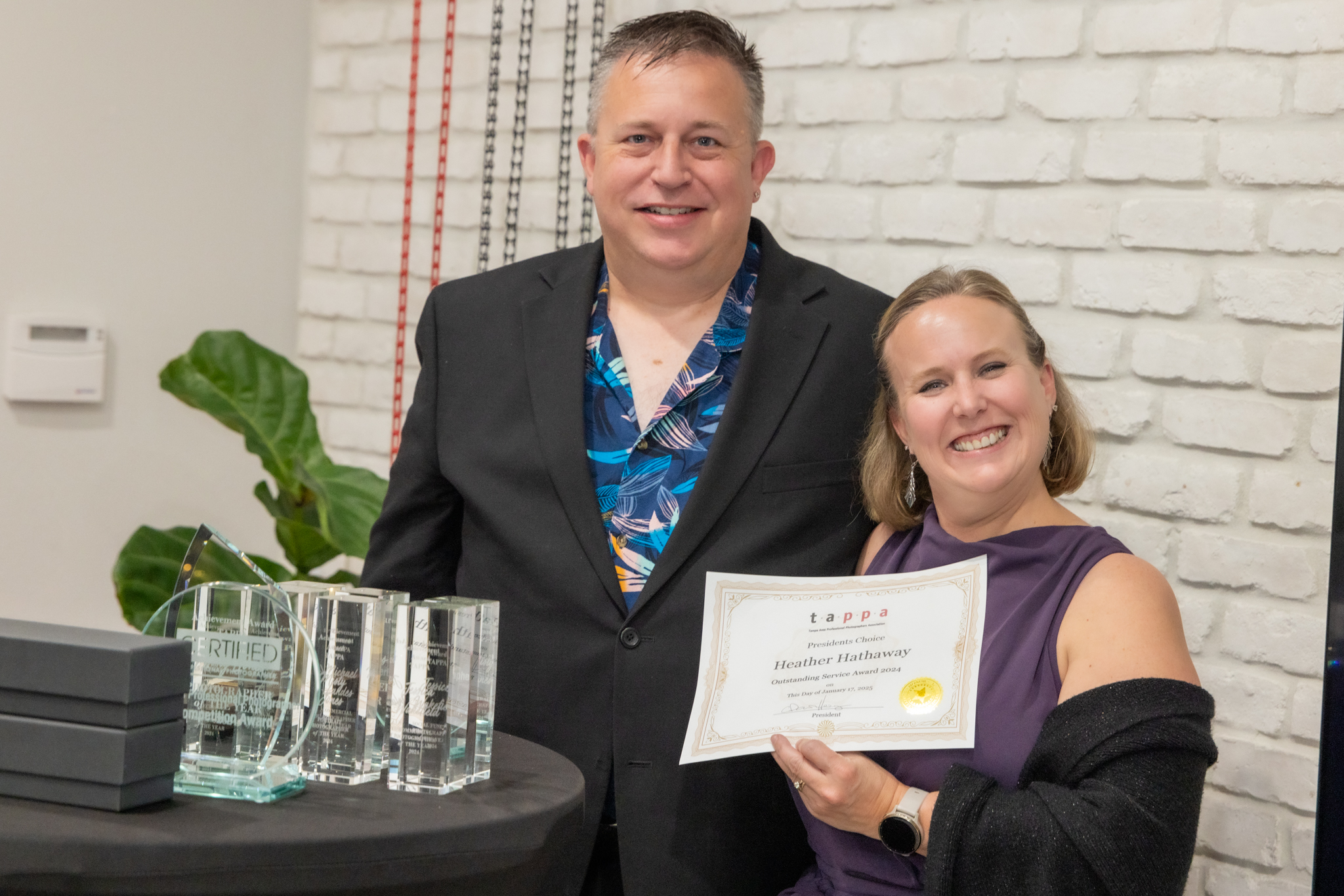 Photographer, Heather Hathaway accept's the 2024 TAPPA President's Choice Award.