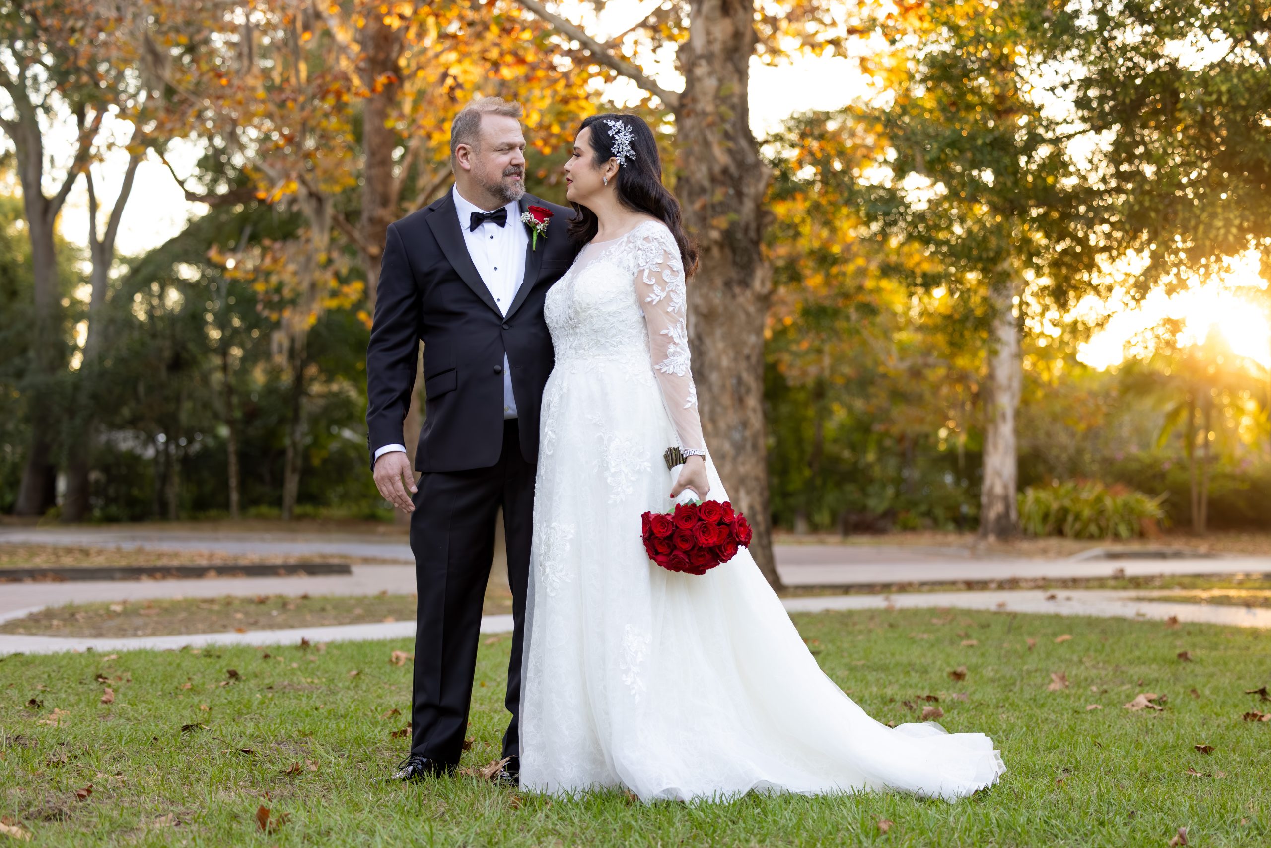 WeddingCouple@Sunset_SocialEvent A couple poses in Mead Botanical Gardens, Orlando, Florida after their wedding ceremony.